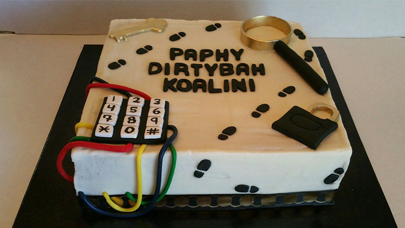 Cake shaped like a puzzle box with steps and a number panel on it.