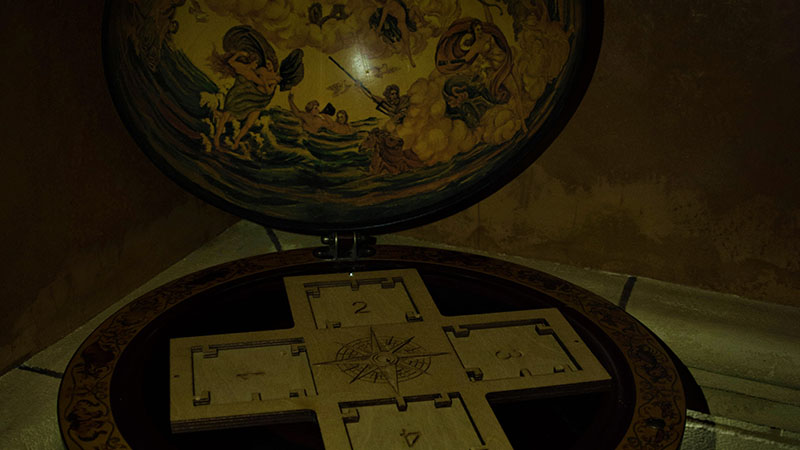 To solve the problem in the castle escape room, the players must interact with the plates. But the globe is so distracting that it's hard to figure out what to do next!