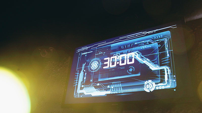 The blue electronic display glows in a dark room. The players only have 30 minutes left to finish the quest.