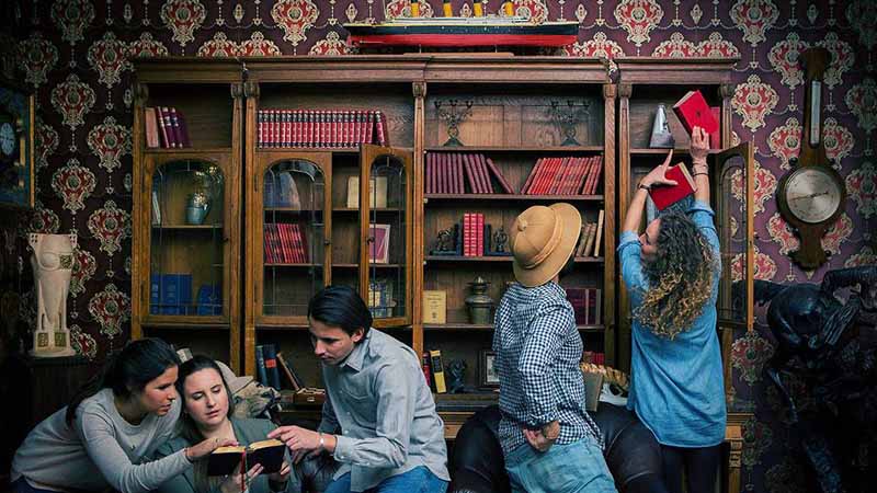 There are so many books on these bookshelves. Luckily this team has many people, so they’ll find the hidden hints in no time!